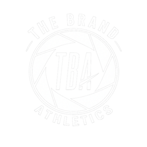 The Brand Athletics white logo with a camera shutter and the initials TBA inside
