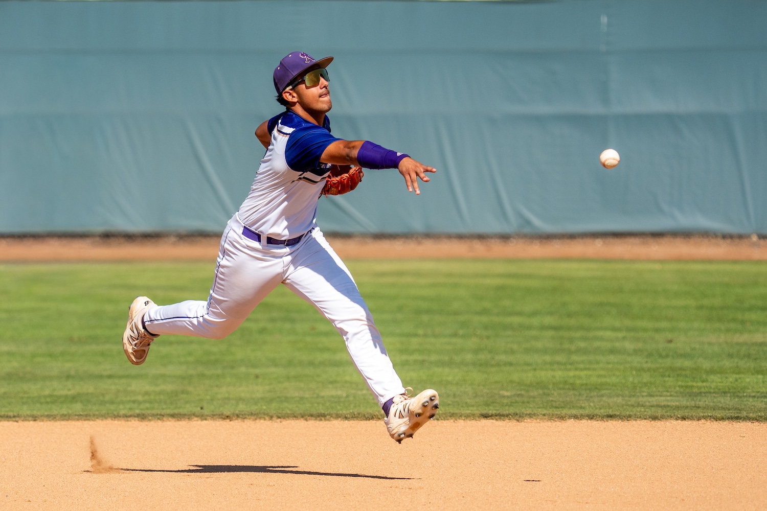 baseball player making a play in the infield