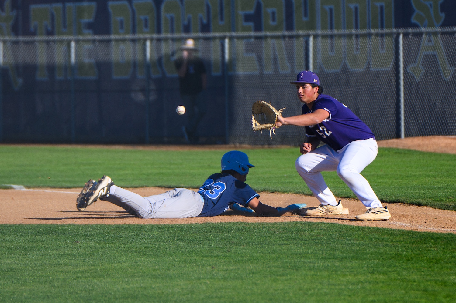 first baseman attempting a pickoff play from the pitcher