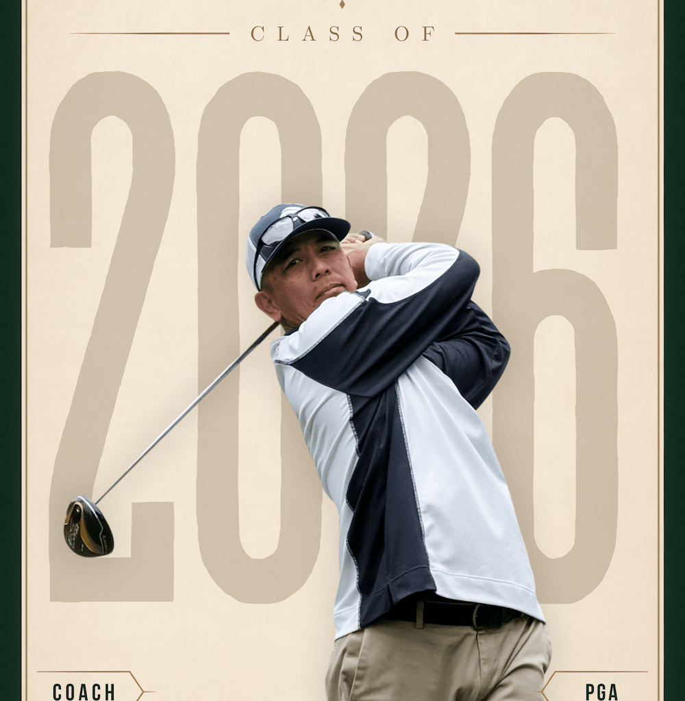golf coach swinging a club for a media day portrait