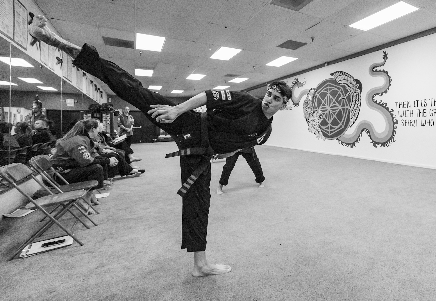 karate teacher throwing a side kick