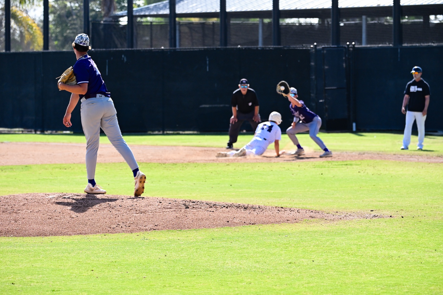 pitcher attempting to pick off the runner at first base