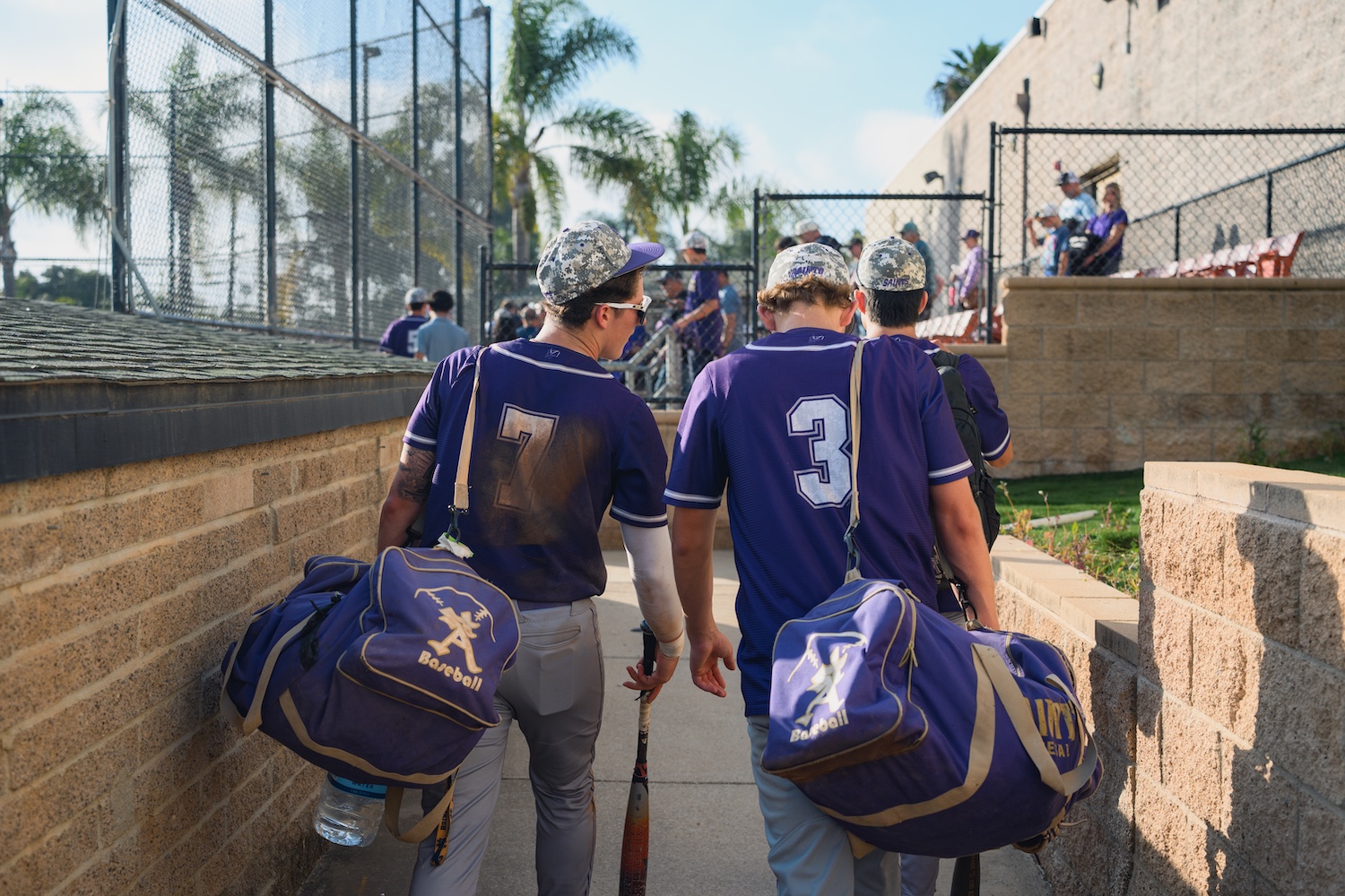 two baseball players walking together after the game